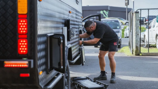 Man working on a vehicle.