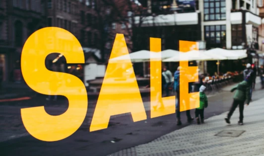 Sale sign on a store window.