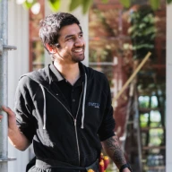 Construction worker smiling in a work site